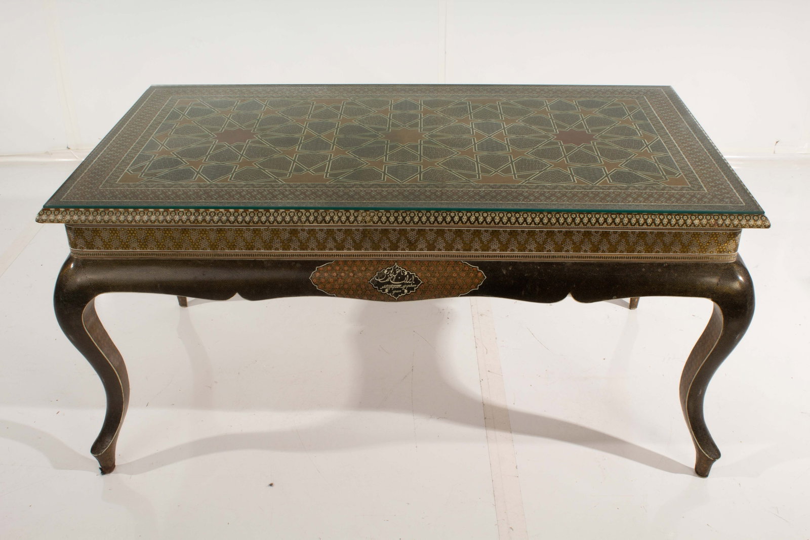 Persian Khatam Coffee Table: Highly intricate inlay. Some Veneer chipping and repaired leg. Small crack in glass.