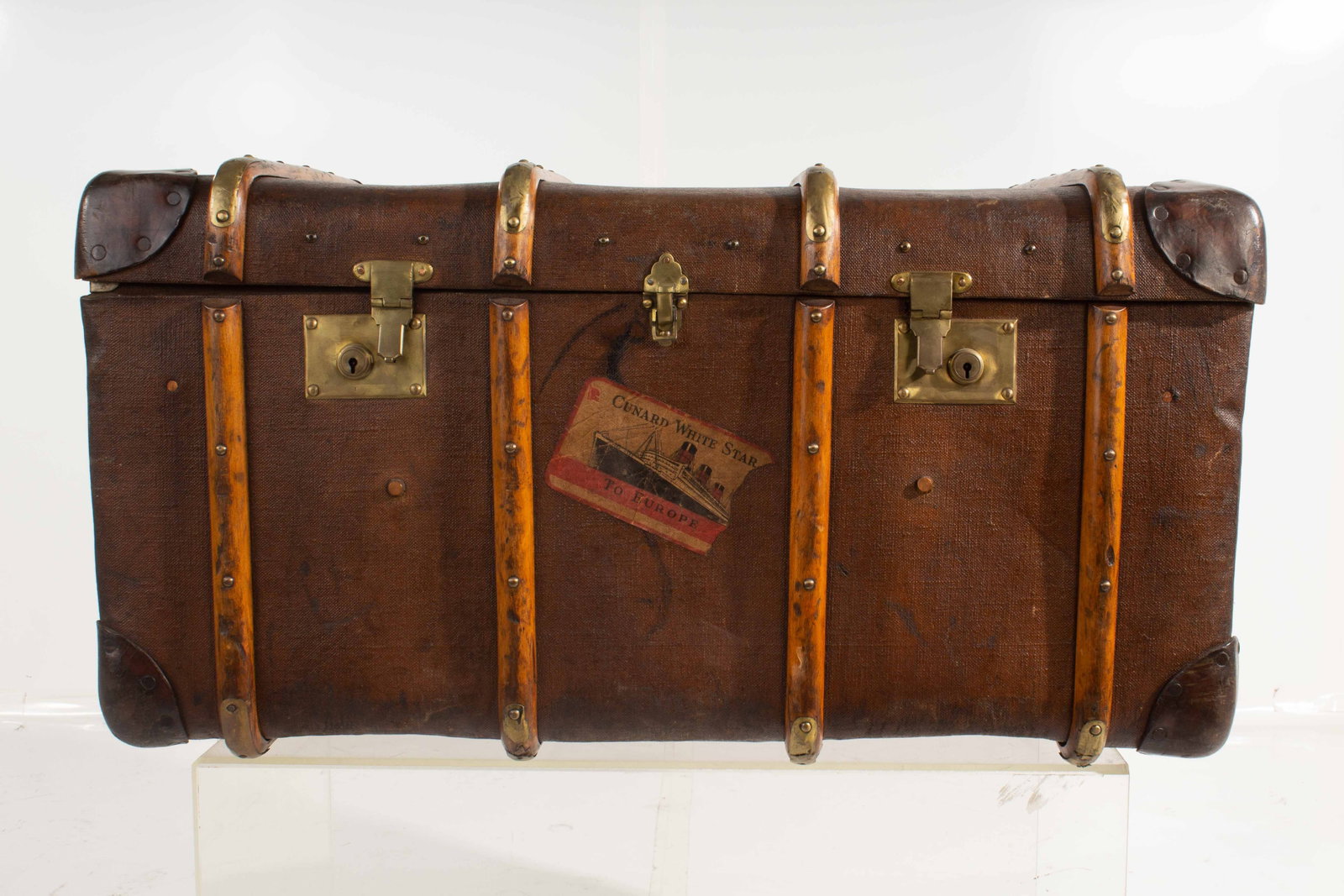 Antique Featherweight Trunk: "Featherweight Warranted Compressed Fiber Regular Trade Mark" Trunk with brass hardware, brass reenforces wooden ribs, leather reenforced hinge and corners, w/ leather and brass handles; Shows ware fr