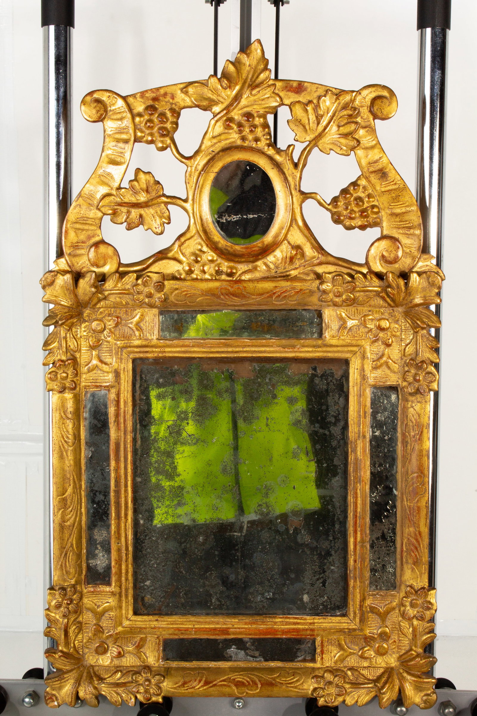 Antique Carved Gilt Mirror, Antique Glass: Antique gilt grapevine and floral carved mirror, with paneled antique glass.