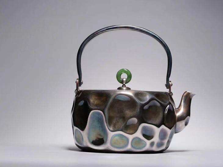A TIN TEAPOT WITH HANDLE,QING DYNASTY (1 of 7)