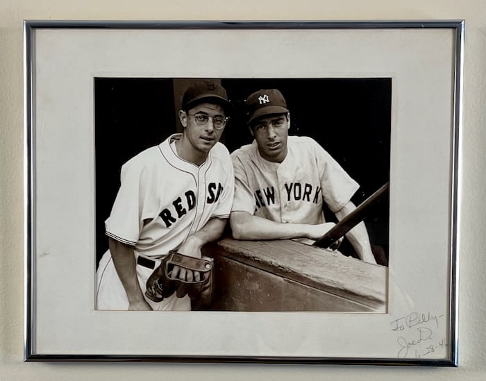New York Italian Sports Legend Joe DiMaggio: Silver gelatin print of the DiMaggio bothers- Joe and Dominick at Fenway Park in 1946. The photograph is personalized "To Billy" and signed "Joe D." and dated. Dimensions: 7 1/2" X 9 1/2". Matted and 