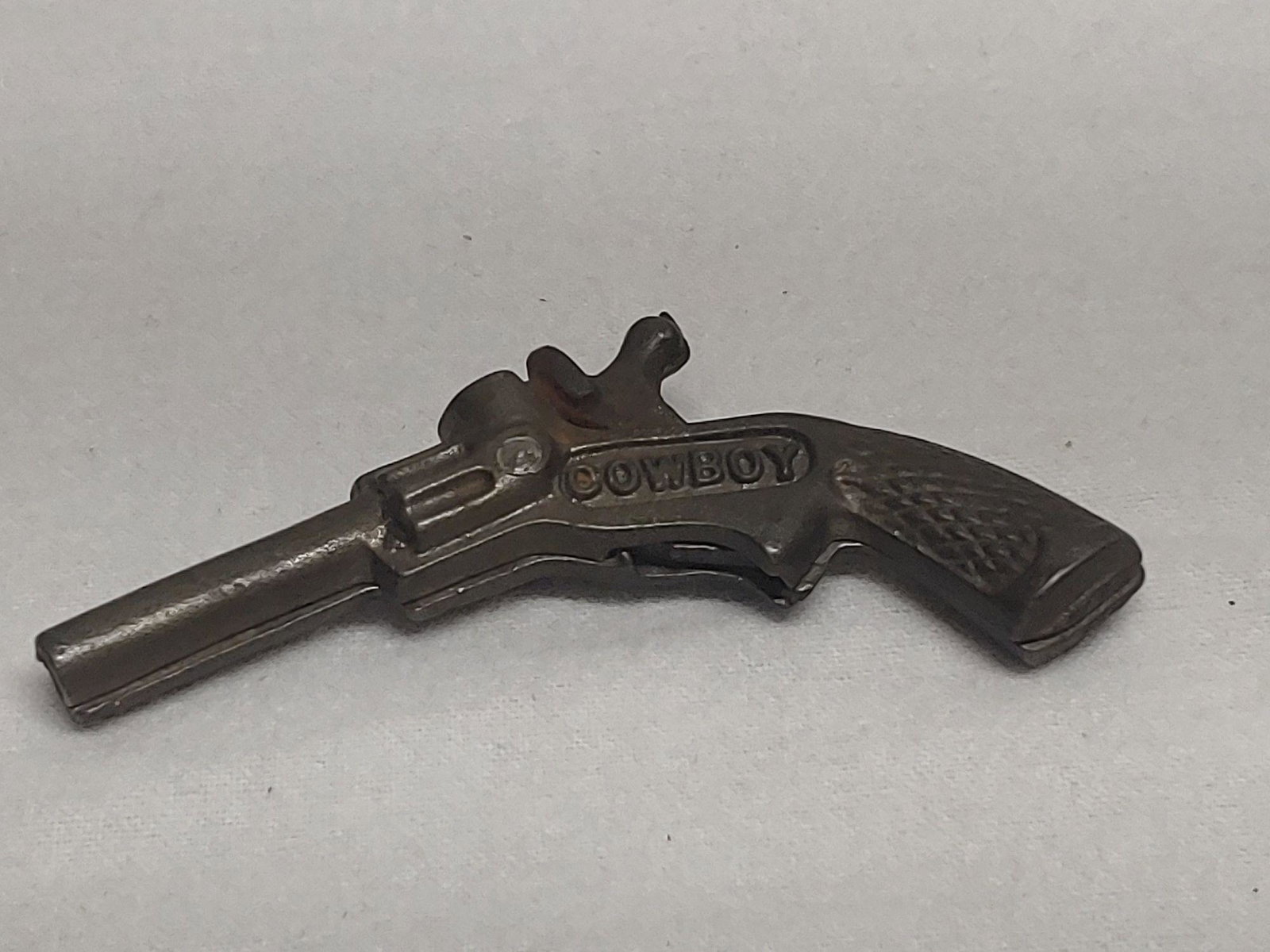 Cast Iron Cowboy Cap Gun: Approx. 3.75" fires