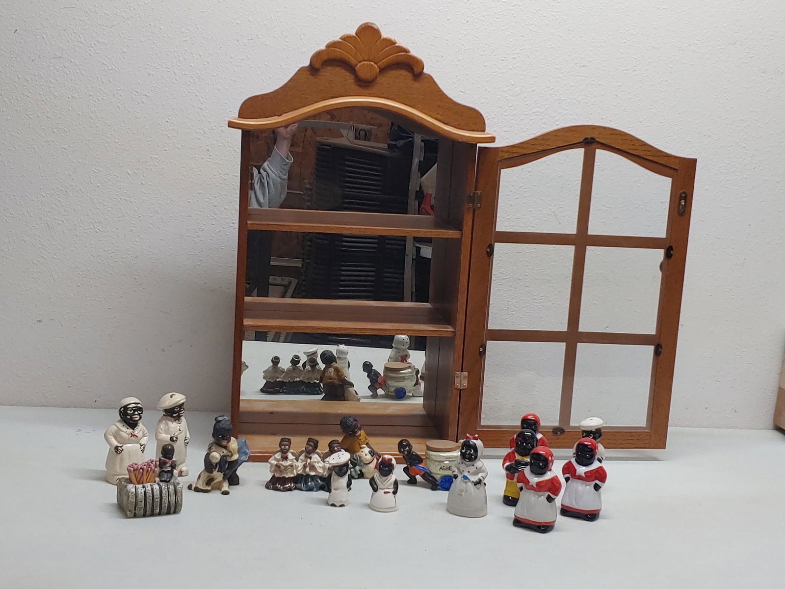 African American collectibles in display: Includes ashtrays and S&P shakers Some Occupied Japan Display approx 25x15 in