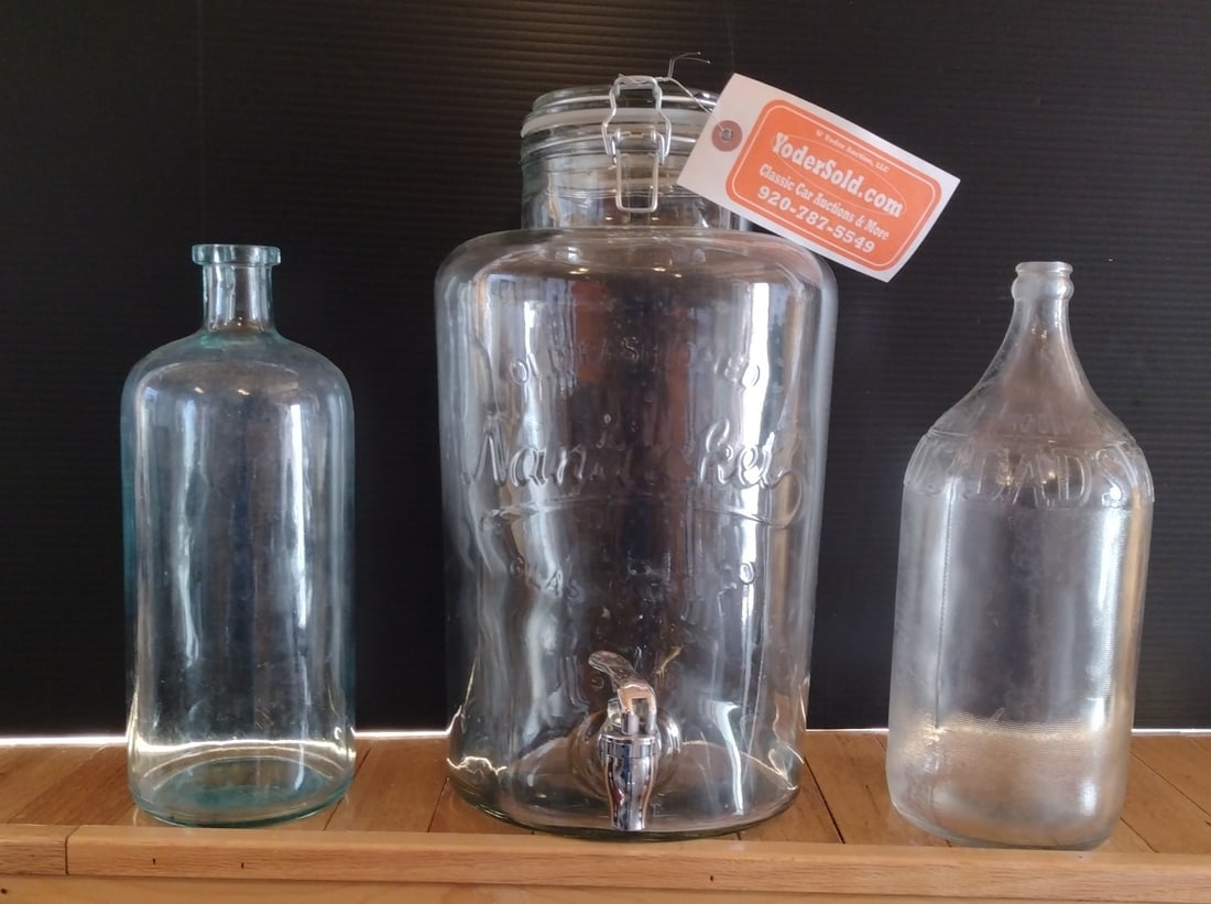 3 Glass Bottles: Embossed Old Fashioned Nantucket Dispenser, Dad's Root Beer, Early Aqua: Tallest Is approx. 14" H A nice lot of glass bottles. Please see photos for condition.