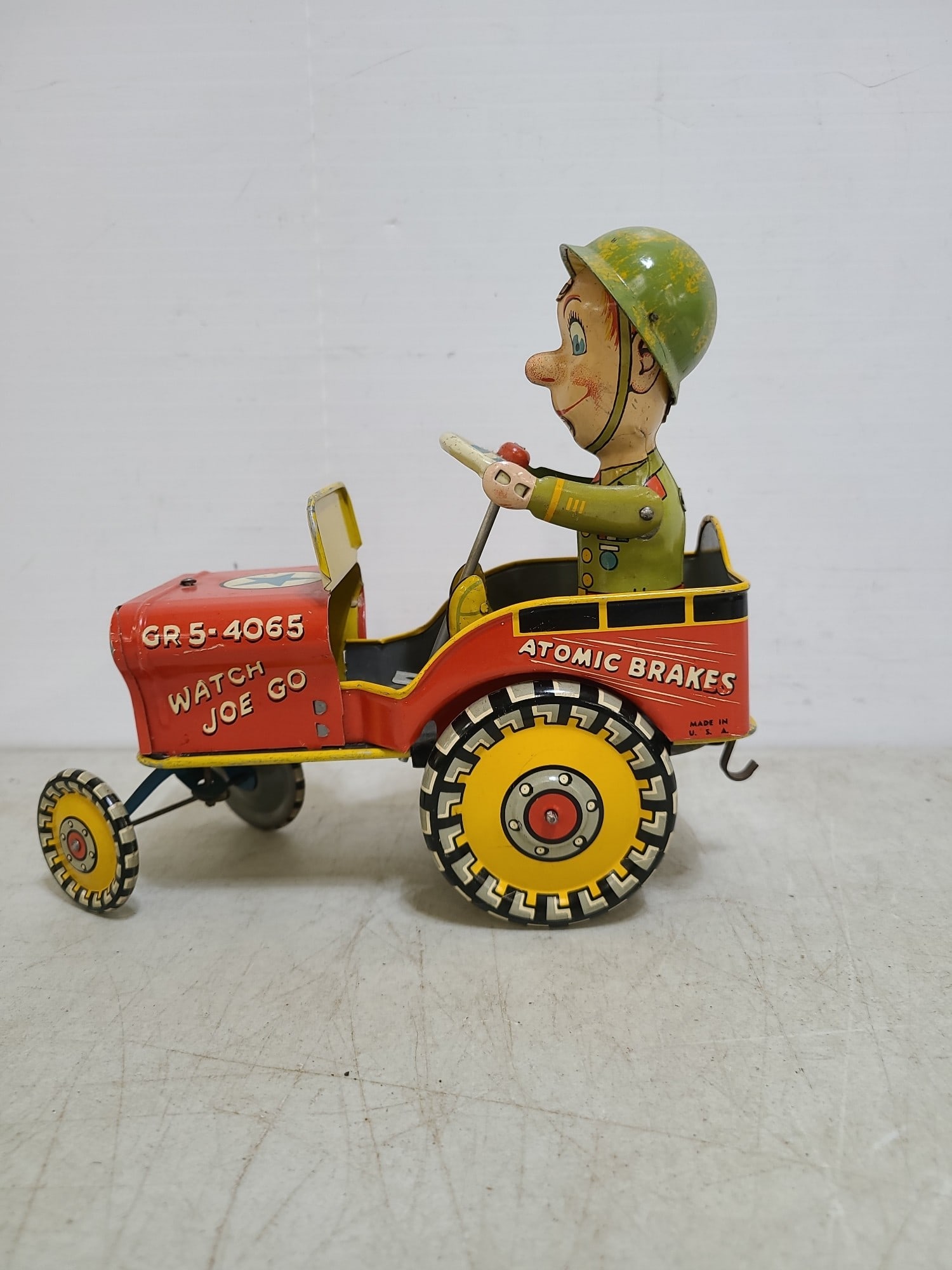 1940's Gi Joe Tin Wind Up Jouncing Toy. Auction