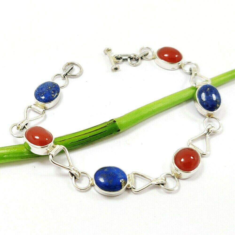 LAPIS LAZULI & CARNELIAN 92.5 STERLING SILVER BRACELET: LAPIS LAZULI & CARNELIAN 92.5 STERLING SILVER BRACELET Product Type : BRACELET Main Stone : LAPIS LAZULI & CARNELIAN Main Stone Shape : OVAL Main Stone Size : 8X10 MM Main Stone Color : RED, BLUE Meta