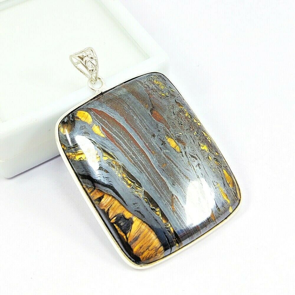 IRON TIGER 925 STERLING SILVER PENDANT: IRON TIGER 925 STERLING SILVER PENDANT Product Type : PENDANT Main Stone : IRON TIGER Main Stone Color : BROWN Metal : STERLING SILVER Metal Purity : 925 Pendant Size : 2" Inches Pendant Weight : 22.2