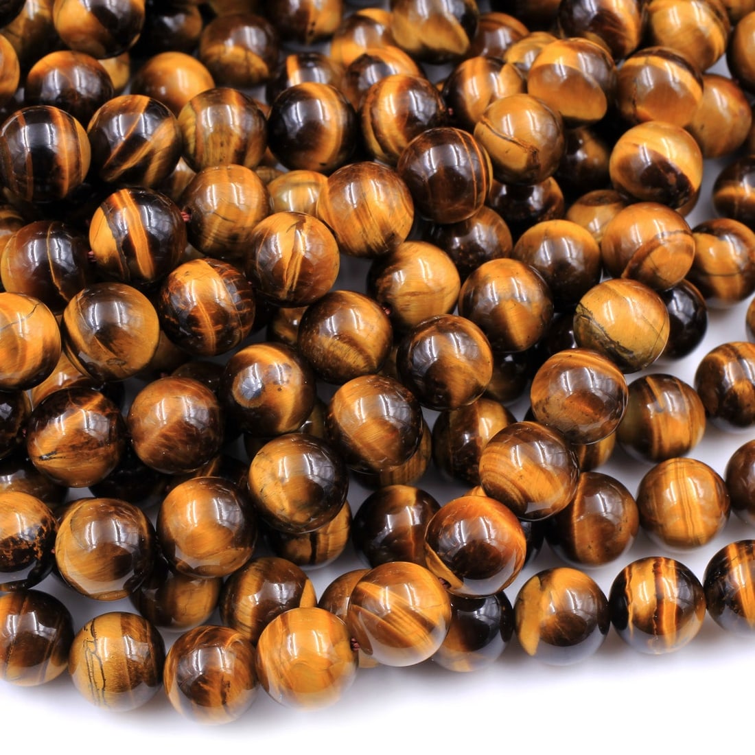 Natural Tiger's Eye Gemstone 6 mm Round Smooth Plain Beads 10 Strand: Natural Tiger's Eye Gemstone 6 mm Round Smooth Plain Beads 10 Strand Product Type : Loose Beads Strand Gemstone : Tiger's Eye Beads Shape : Round Smooth Plain Beads Size : 6 mm Quantity :