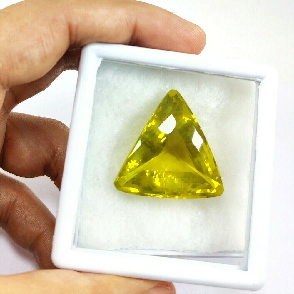 Natural Lemon Quartz Trillion Checker Board Cut 77.2 Carats Gemstone: Natural Lemon Quartz Trillion Checker Board Cut 77.2 Carats Gemstone Gemstone : Lemon Quartz Stone Shape : Trillion Stone Cutting Type : Checker Board Cut Stone Weight : 77.2 Carats Stone Meas
