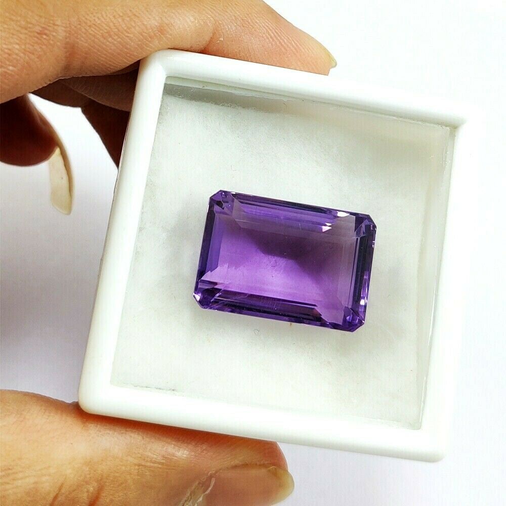 Natural Amethyst Emerald Faceted Cut 47.05 Carats Gemstone: Natural Amethyst Emerald Faceted Cut 47.05 Carats Gemstone Gemstone : Amethyst Stone Shape : Emerald Stone Cutting Type : Faceted Cut Stone Weight : 47.05 Carats Stone Measurement : 24x1