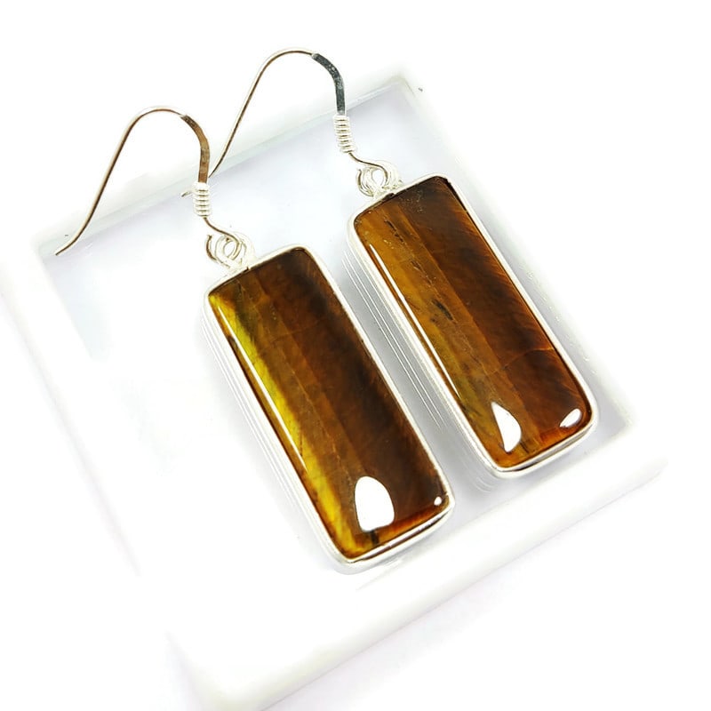 TIGER'S EYE 92.5 STERLING SILVER EARRING: TIGER'S EYE 92.5 STERLING SILVER EARRING Product Type : EARRING Main Stone : TIGER'S EYE Main Stone Shape : OCTAGON Main Stone Size : 27X11 MM Main Stone Color : BROWN Metal : STERLING SILVER Metal Pu