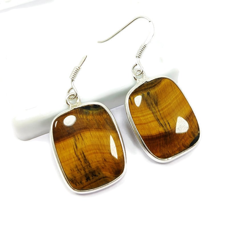 TIGER'S EYE 92.5 STERLING SILVER EARRING: TIGER'S EYE 92.5 STERLING SILVER EARRING Product Type : EARRING Main Stone : TIGER'S EYE Main Stone Shape : CUSHION Main Stone Size : 20X17 MM Main Stone Color : BROWN Metal : STERLING SILVER Metal Pu