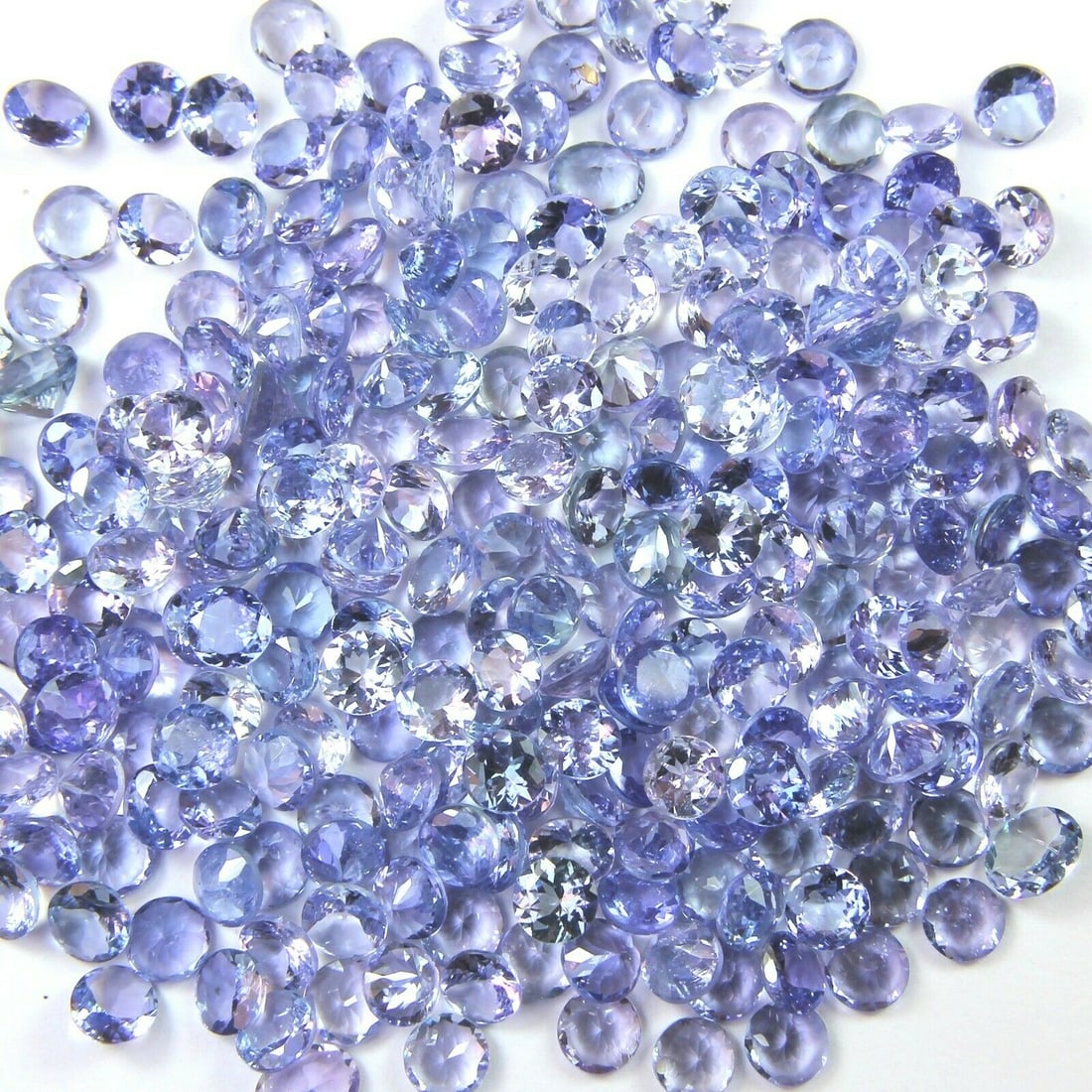 Tanzanite 2 MM Round Faceted Cut 200 Pieces: Natural Tanzanite 2 MM Round Faceted Cut 200 Pieces Gemstone : Tanzanite Shape : Round Size : 2 MM Color : Blue Type : Faceted Cut Quantity : 200 Pieces Weight : 8.00 C