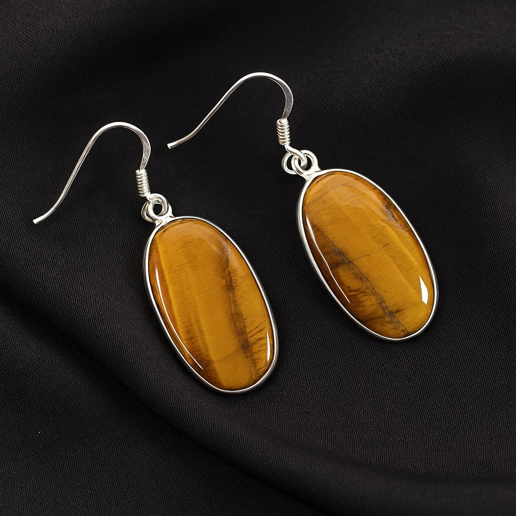 TIGER'S EYE 92.5 STERLING SILVER EARRING: TIGER'S EYE 92.5 STERLING SILVER EARRING Product Type : EARRING Main Stone : TIGER'S EYE Main Stone Shape : OVAL Main Stone Size : 27X15 MM Main Stone Color : BROWN Metal : STERLING SILVER Metal Purit