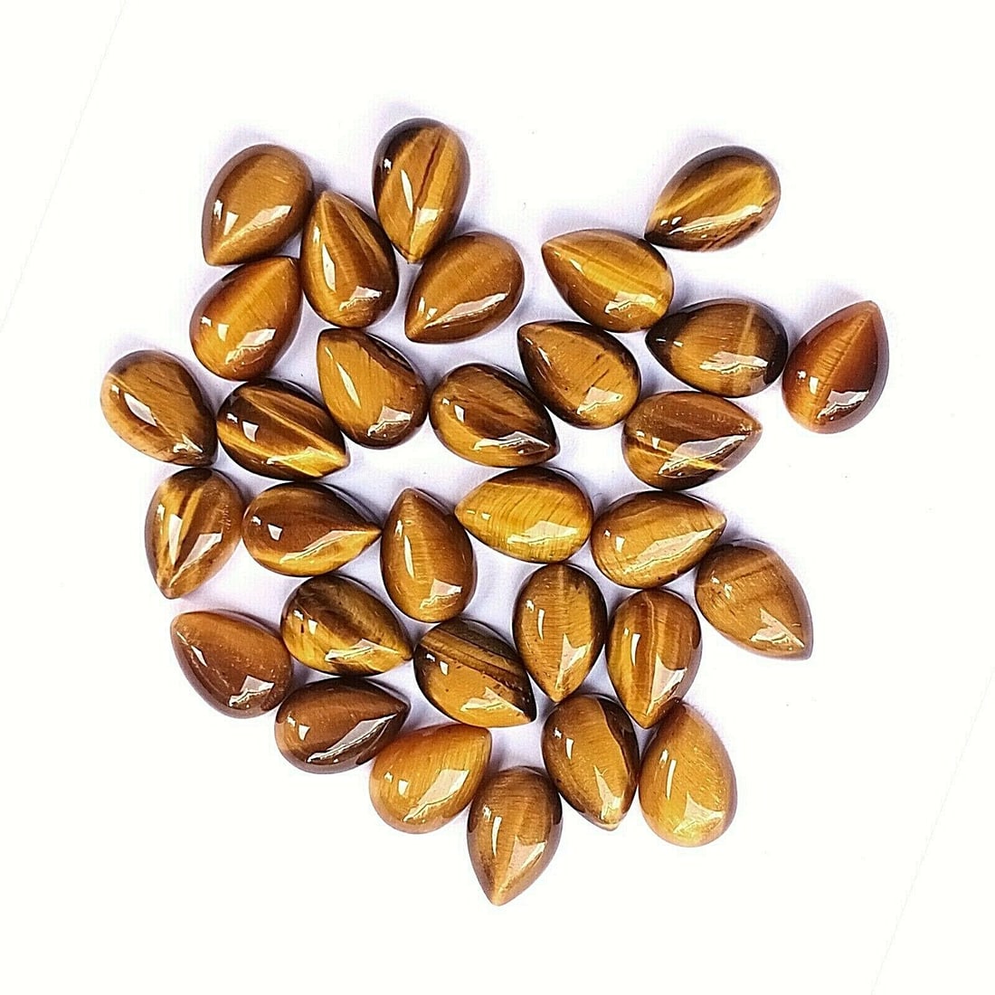 Tiger's Eye 7x5 MM Pear Cabochon 50 Pieces: Natural Tiger's Eye 7x5 MM Pear Cabochon 50 Pieces Gemstone : Tiger's Eye Shape : Pear Size : 7x5 MM Color : Brown Type : Cabochon Quantity : 50 Pieces Weight : 38 Cara
