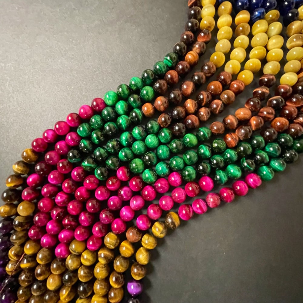 Natural Multi Tiger'e Eye Gemstone 6 mm Round Smooth Plain Beads 5 Strand: Natural Multi Tiger'e Eye Gemstone 6 mm Micro Round Smooth Plain Beads Rondelle 5 Strand 15.5 Inches Each Product Type : Loose Beads Strand Gemstone : Multi Tiger'e Eye Beads Shape : Round Smooth Plai