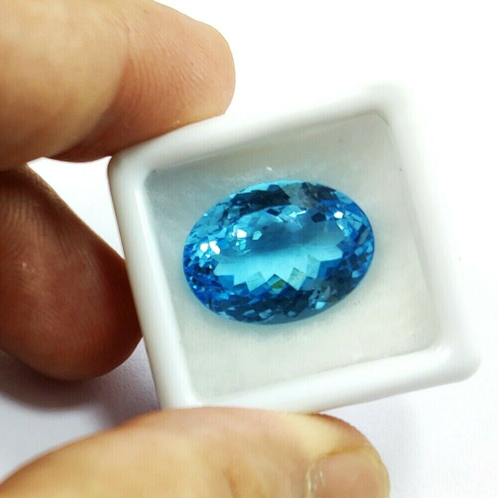 Natural Blue Topaz Oval Faceted Cut 21.7 Carats Gemstone: Natural Blue Topaz Oval Faceted Cut 21.7 Carats Gemstone Gemstone : Blue Topaz Stone Shape : Oval Stone Cutting Type : Faceted Cut Stone Weight : 21.7 Carats Stone Measurement : 18x13x11 M