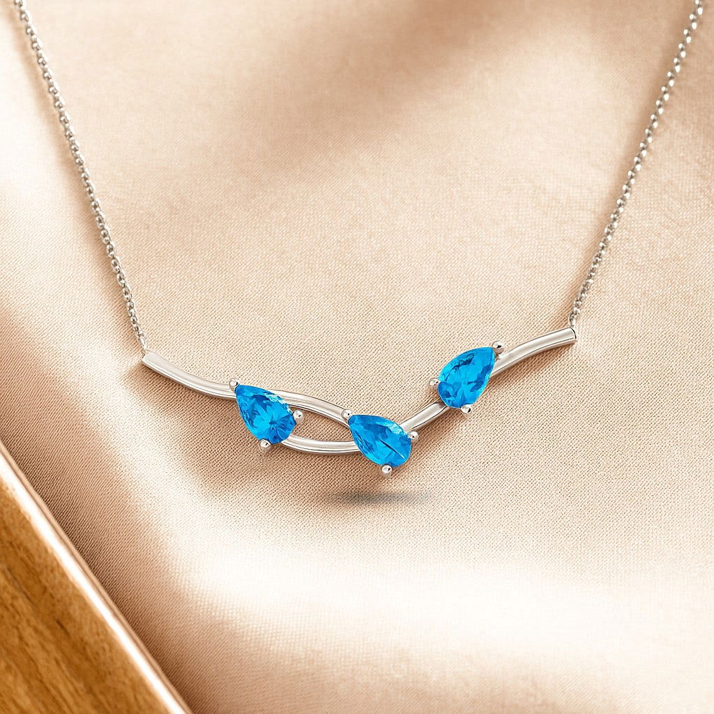 Natural Swiss Blue Topaz Gemstone 92.5 Sterling Silver Necklace: Natural Swiss Blue Topaz Gemstone 92.5 Sterling Silver Necklace Gemstone Shape : Pear Gemstone Size : 3 MM Gemstone Quantity : 3 Pieces Metal : Silver Metal Purity : 92.5 Sterling Silver Pendan