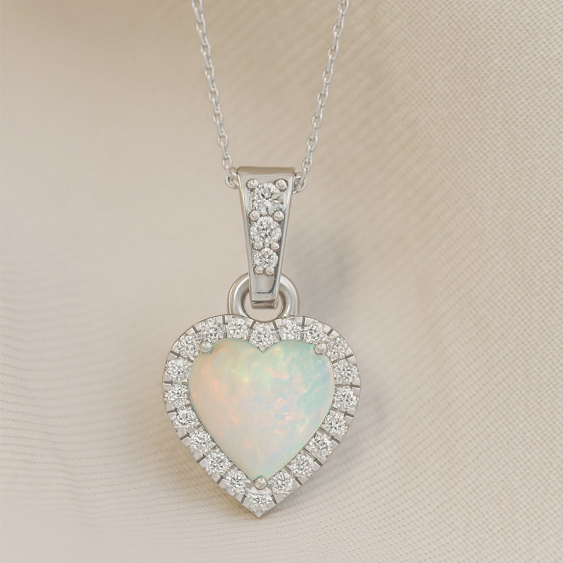 Natural Opal & Diamond 92.5 Sterling Silver Pendant with Chain: Natural Opal & Diamond 92.5 Sterling Silver Pendant with Chain Gemstone Shape : Heart Gemstone Size : 6 MM Gemstone Quantity : 1 Piece Diamond Type : Lab Grown Diamond Shape : Round Diamond Col