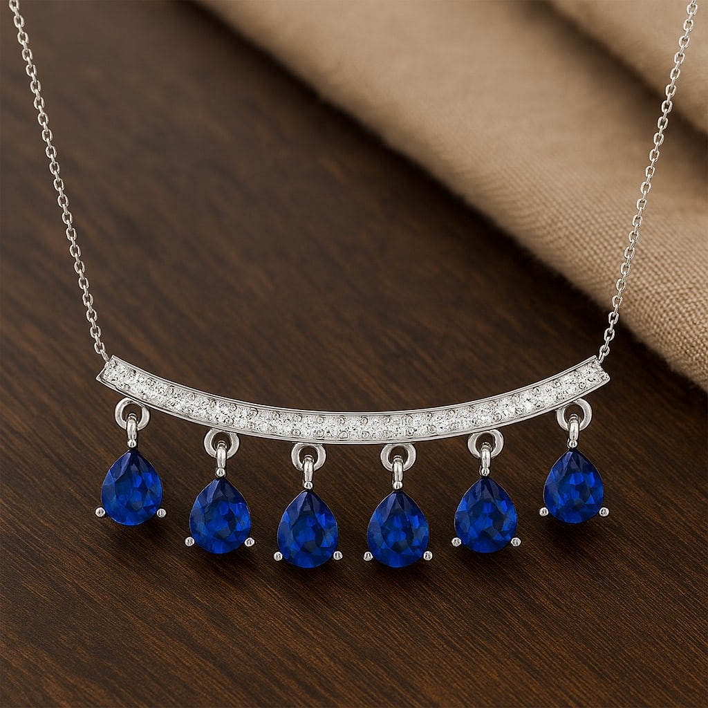 Natural Blue Sapphire & Diamond 92.5 Sterling Silver Necklace: Natural Blue Sapphire & Diamond 92.5 Sterling Silver Necklace Gemstone Shape : Pear Gemstone Size : 5x4 MM Gemstone Quantity : 6 Pieces Diamond Type : Lab Grown Diamond Shape : Round Diamond Co