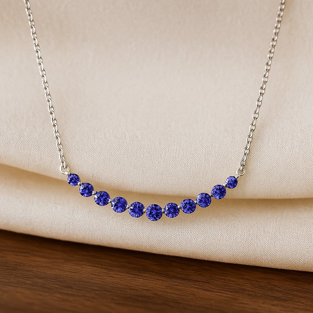 Natural Tanzanite Gemstone 92.5 Sterling Silver Necklace: Natural Tanzanite Gemstone 92.5 Sterling Silver Necklace Gemstone Shape : Round Gemstone Size : 3.5 - 6 MM Gemstone Quantity : 11 Pieces Metal : Silver Metal Purity : 92.5 Sterling Silver Penda