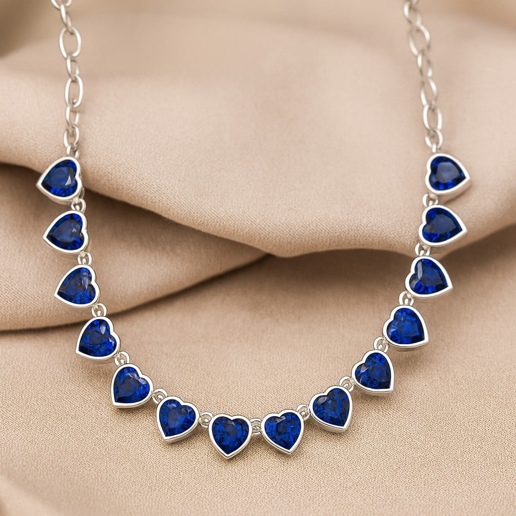 Natural Blue Sapphire Gemstone 92.5 Sterling Silver Necklace: Natural Blue Sapphire Gemstone 92.5 Sterling Silver Necklace Gemstone Shape : Heart Gemstone Size : 5 MM Gemstone Quantity : 15 Pieces Metal : Silver Metal Purity : 92.5 Sterling Silver Pendant