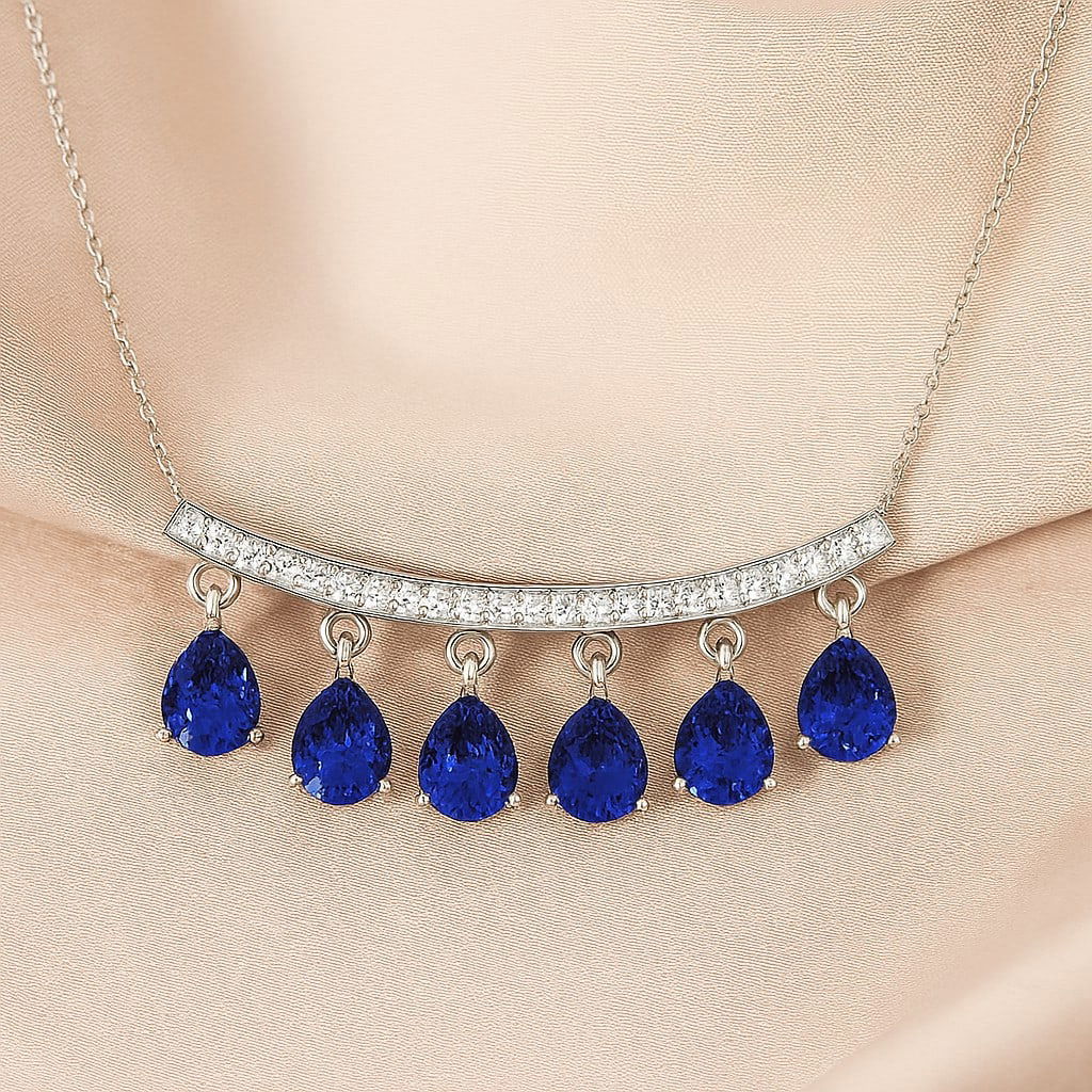 Natural Tanzanite & Diamond 92.5 Sterling Silver Necklace: Natural Tanzanite & Diamond 92.5 Sterling Silver Necklace Gemstone Shape : Pear Gemstone Size : 5x4 MM Gemstone Quantity : 6 Pieces Diamond Type : Lab Grown Diamond Shape : Round Diamond Color