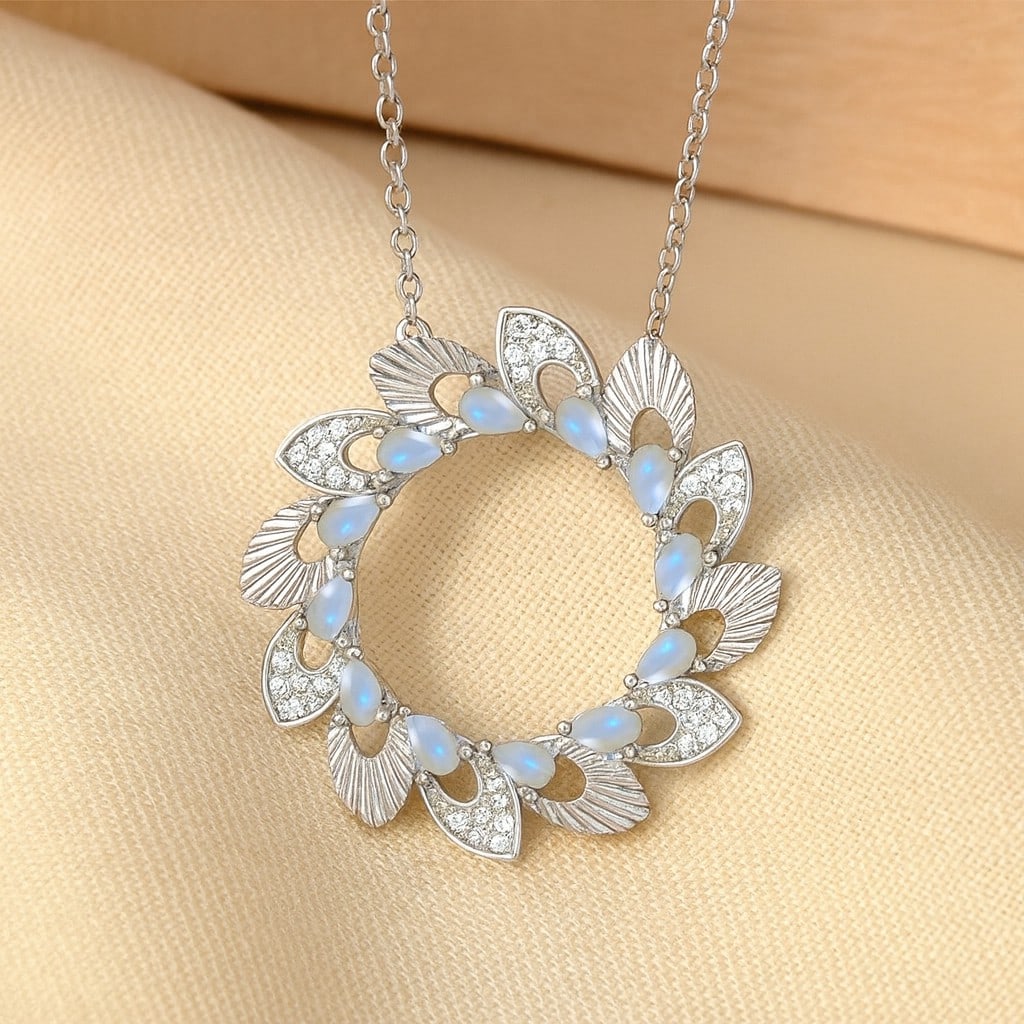 Natural Moonstone & Diamond 92.5 Sterling Silver Pendant with Chain: Natural Moonstone & Diamond 92.5 Sterling Silver Pendant with Chain Gemstone Shape : Pear Gemstone Size : 3x2 MM Gemstone Quantity : 12 Pieces Diamond Type : Lab Grown Diamond Shape : Round Dia