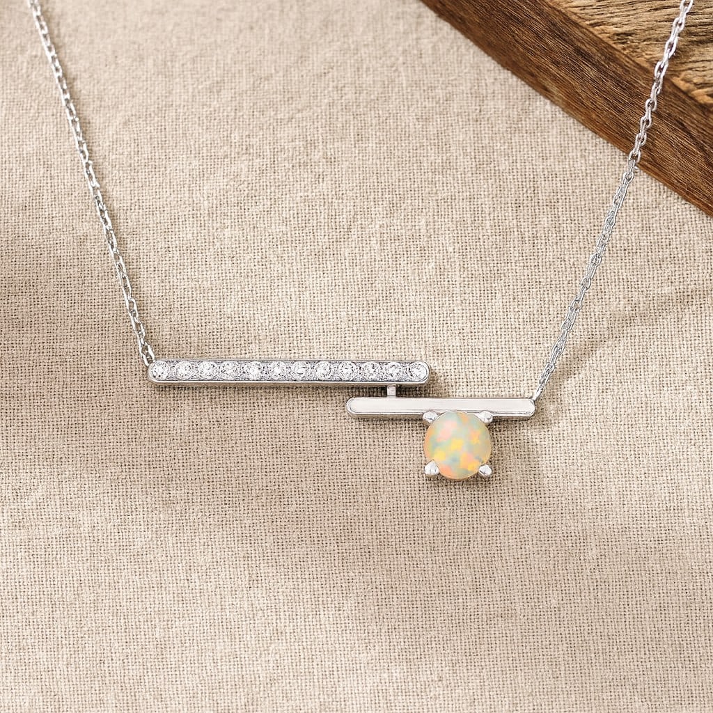 Natural Opal & Diamond 92.5 Sterling Silver Necklace: Natural Opal & Diamond 92.5 Sterling Silver Necklace Gemstone Shape : Round Gemstone Size : 3.5 MM Gemstone Quantity : 1 Piece Diamond Type : Lab Grown Diamond Shape : Round Diamond Color :