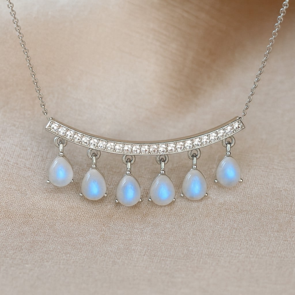 Natural Moonstone & Diamond 92.5 Sterling Silver Necklace: Natural Moonstone & Diamond 92.5 Sterling Silver Necklace Gemstone Shape : Pear Gemstone Size : 5x4 MM Gemstone Quantity : 6 Pieces Diamond Type : Lab Grown Diamond Shape : Round Diamond Color