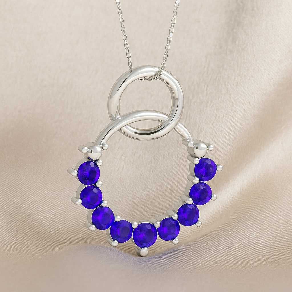 Natural Tanzanite Gemstone 92.5 Sterling Silver Pendant with Chain: Natural Tanzanite Gemstone 92.5 Sterling Silver Pendant with Chain Gemstone Shape : Round Gemstone Size : 3 MM, 2.5 MM Gemstone Quantity : 9 Pieces Metal : Silver Metal Purity : 92.5 Sterling Silver</