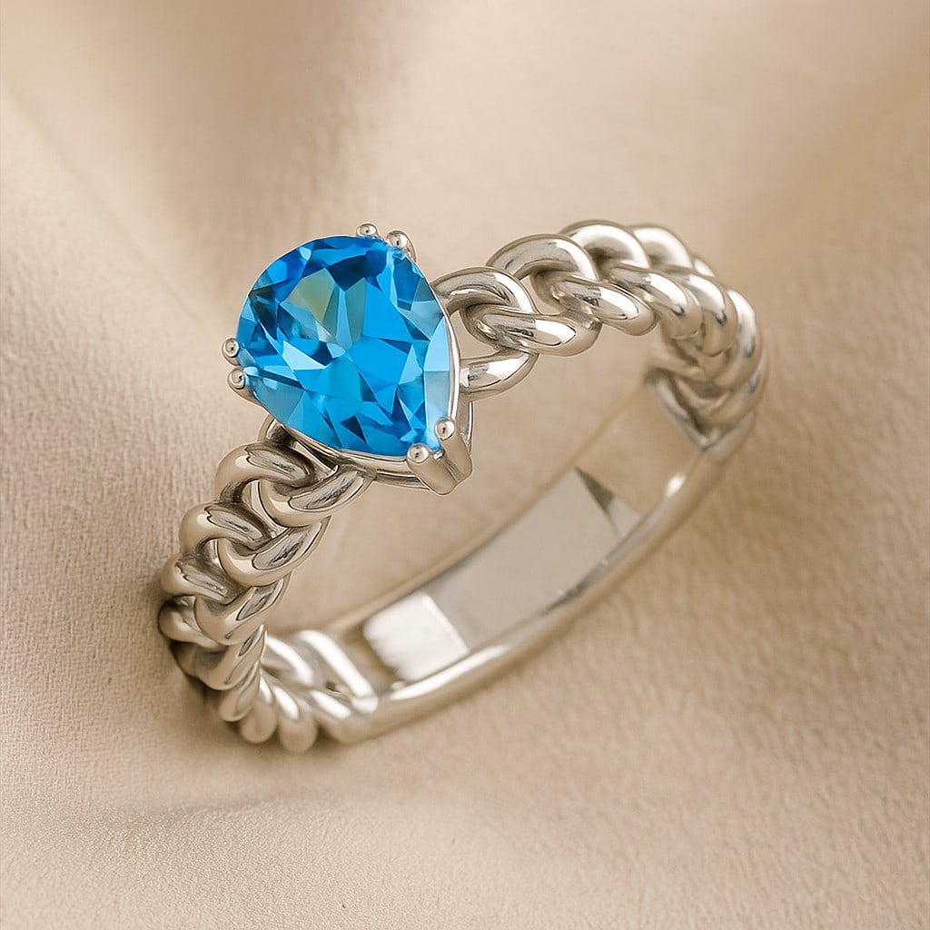 Natural Swiss Blue Topaz Gemstone 92.5 Sterling Silver Ring: Natural Swiss Blue Topaz Gemstone 92.5 Sterling Silver Ring Jewelry Type : Ring Gemstone : Natural Swiss Blue Topaz Gemstone Shape : Pear Gemstone Size : 8x6 MM Gemstone Quantity : 1 Piece M