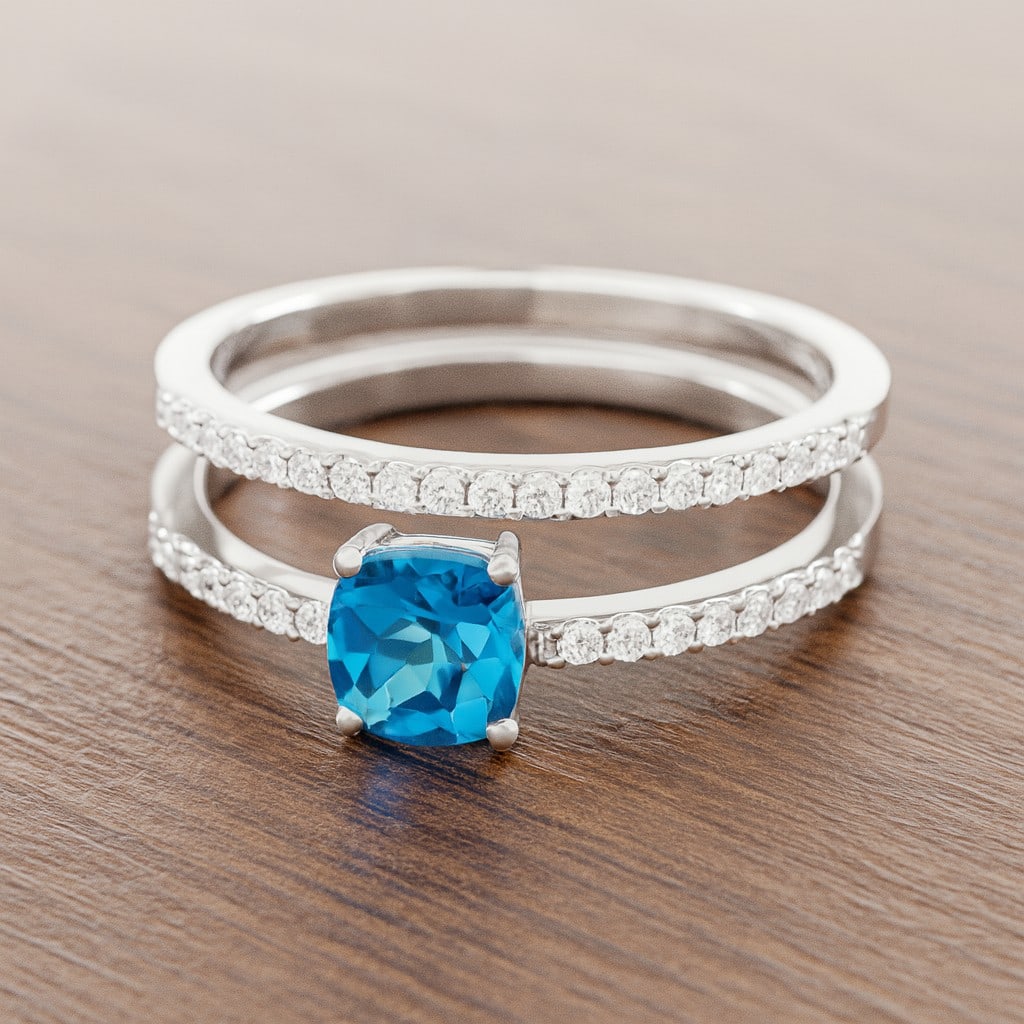 Natural Swiss Blue Topaz Gemstone & Lab Grown Diamonds Silver Ring: Natural Swiss Blue Topaz Gemstone & Lab Grown Diamonds Silver Ring Jewelry Type : Ring Gemstone : Natural Swiss Blue Topaz Gemstone Shape : Cushion Square Gemstone Size : 5 MM Gemstone Quantity : 1
