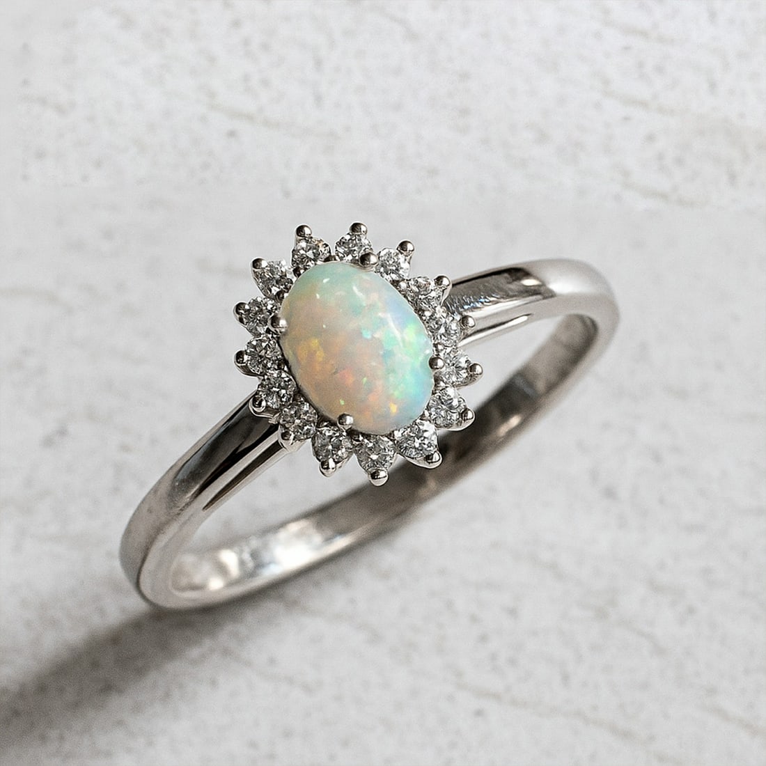 Natural Opal Gemstone & Lab Grown Diamonds Silver Ring: Natural Opal Gemstone & Lab Grown Diamonds Silver Ring Jewelry Type : Ring Gemstone : Natural Opal Gemstone Shape : Oval Gemstone Size : 7x5 MM Gemstone Quantity : 1 Piece Diamond Type :