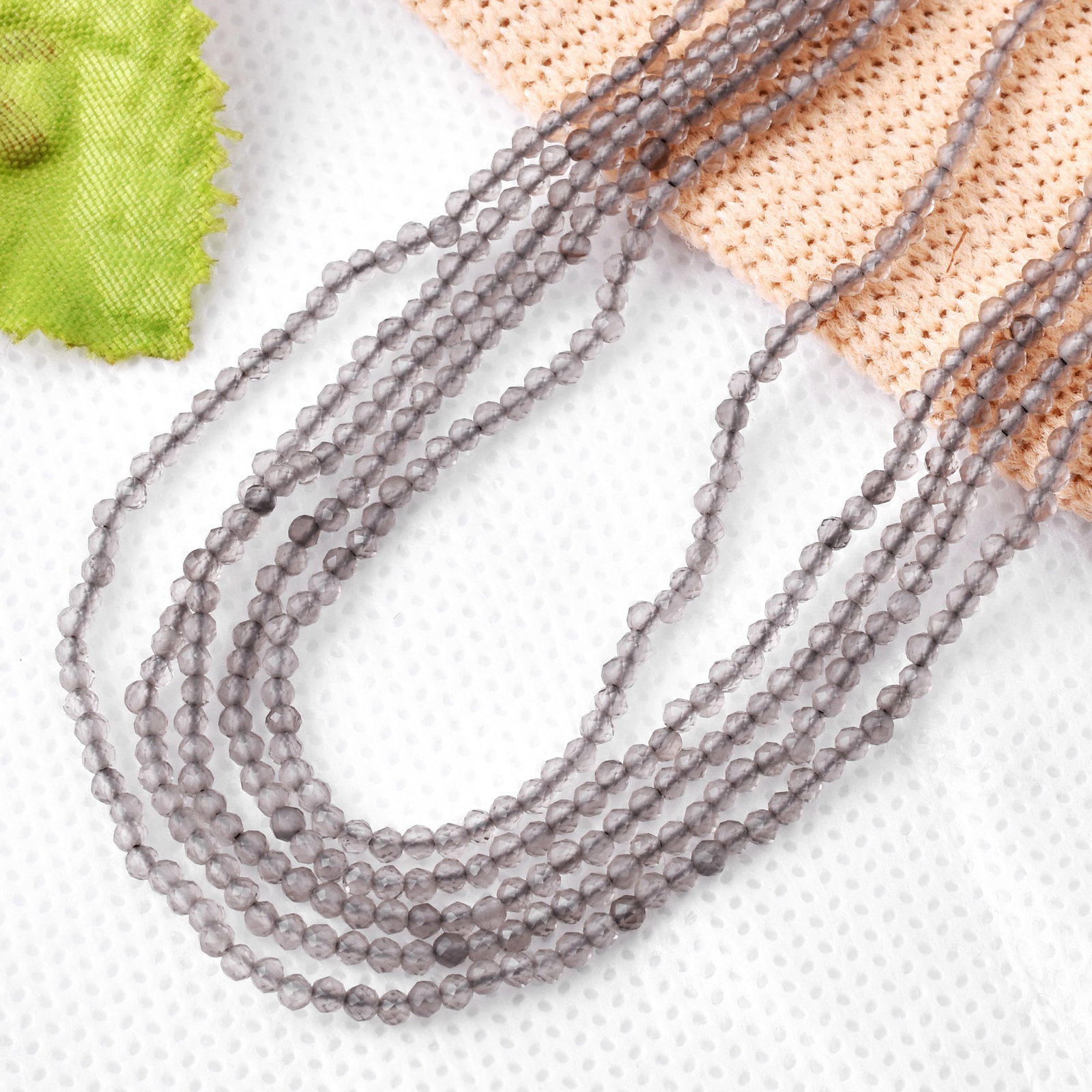 Natural Ice Obsidian 2 MM Round Faceted 5 String Beads Necklace: Natural Ice Obsidian 2 MM Round Faceted 5 String Beads Necklace Product Type : Necklace Main Stone : Ice Obsidian Main Stone Shape : Round Main Stone Size : 2 MM Beads Type : Faceted Closure