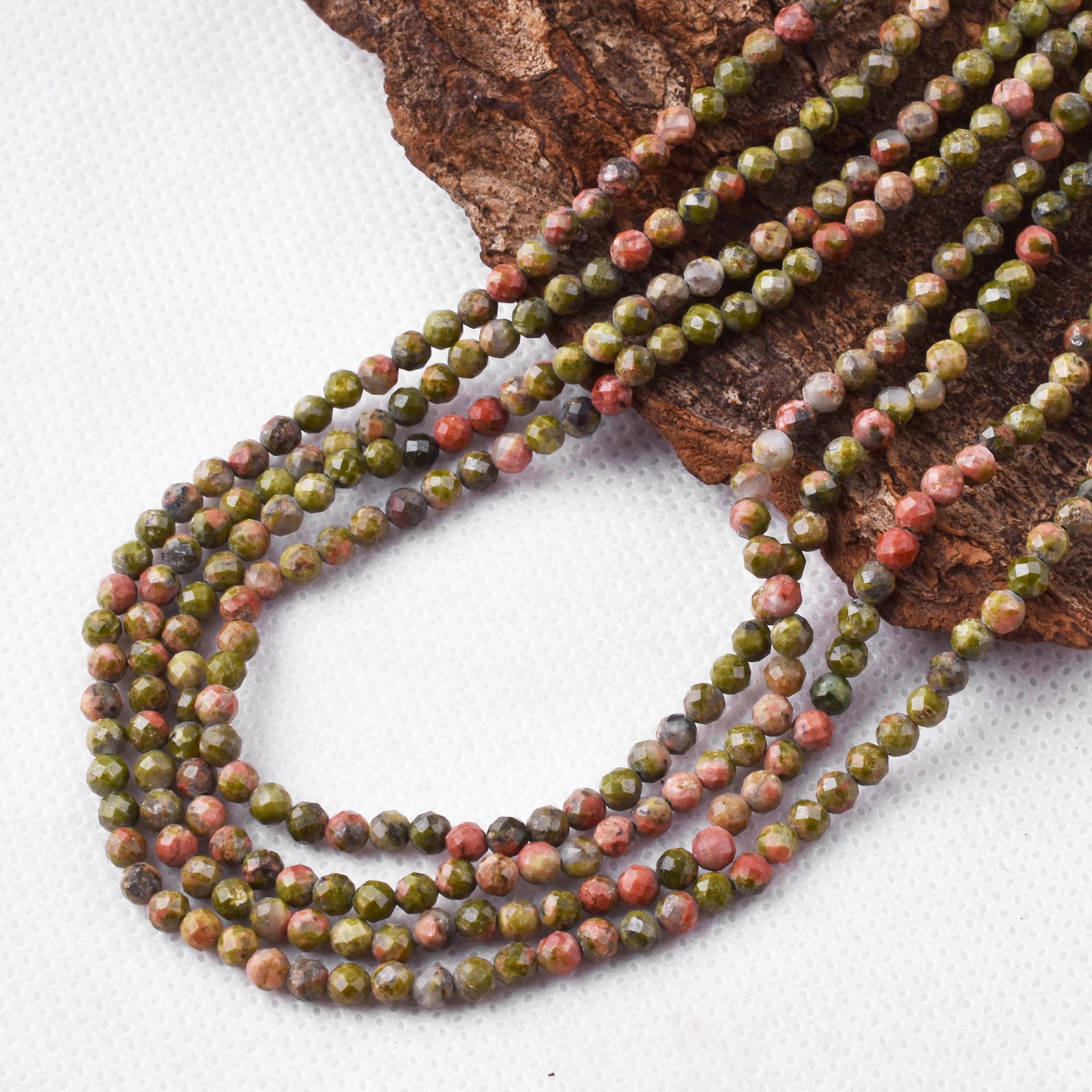 Natural Unakite 3 MM Round Faceted 4 String Beads Necklace: Natural Unakite 3 MM Round Faceted 4 String Beads Necklace Product Type : Necklace Main Stone : Unakite Main Stone Shape : Round Main Stone Size : 3 MM Beads Type : Faceted Closure Type :