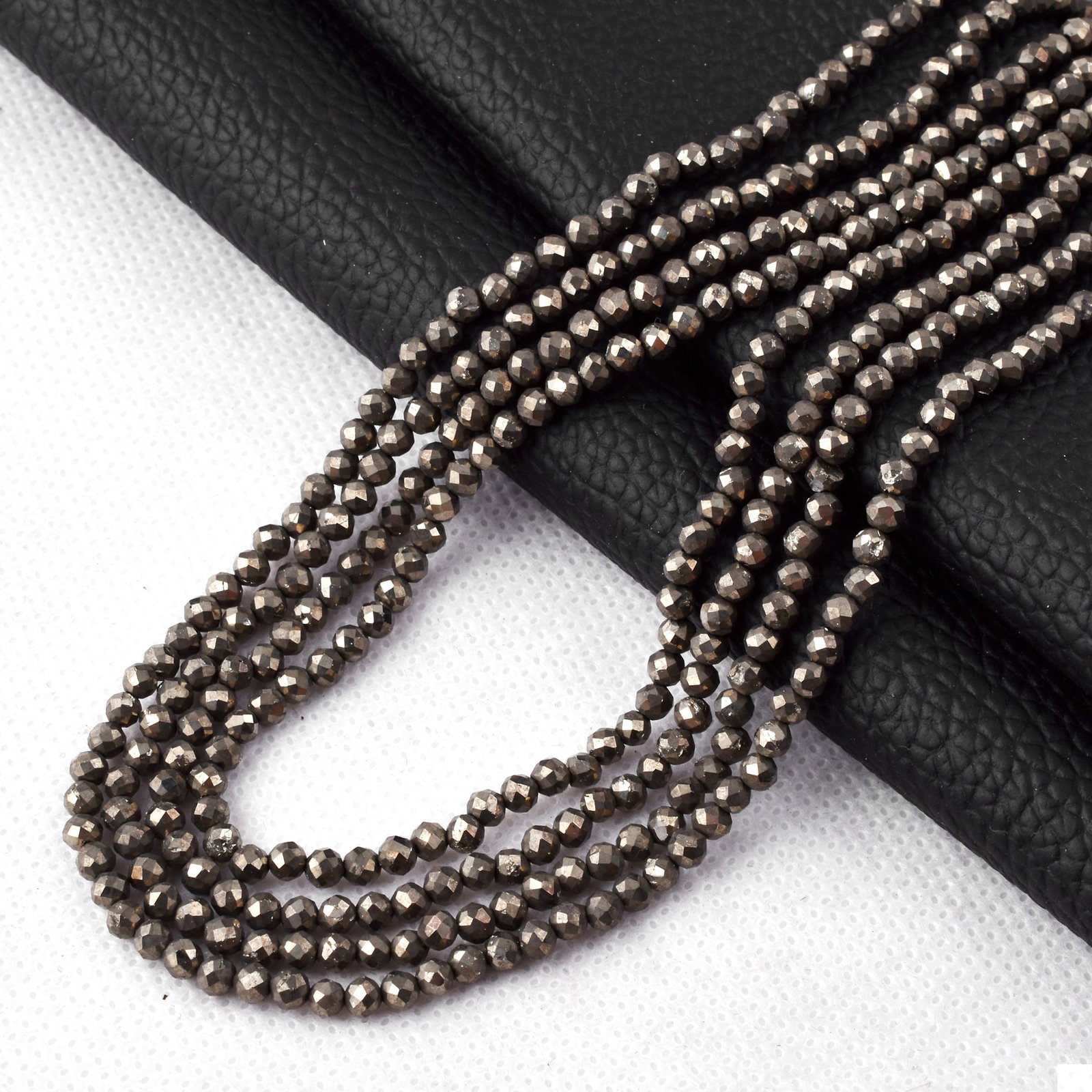 Natural Pyrite 3 MM Round Faceted 4 String Beads Necklace: Natural Pyrite 3 MM Round Faceted 4 String Beads Necklace Product Type : Necklace Main Stone : Pyrite Main Stone Shape : Round Main Stone Size : 3 MM Beads Type : Faceted Closure Type : S