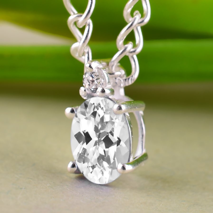 Natural White Topaz & Diamond 14 KT Yellow Gold Pendant: Natural White Topaz & Diamond 14 KT Yellow Gold Pendant Jewelry Type : Pendant Main Stone : White Topaz & Diamond Main Stone Shape & Size : Oval 7x5 MM Main Stone Color : White Diamond Shape & Size :
