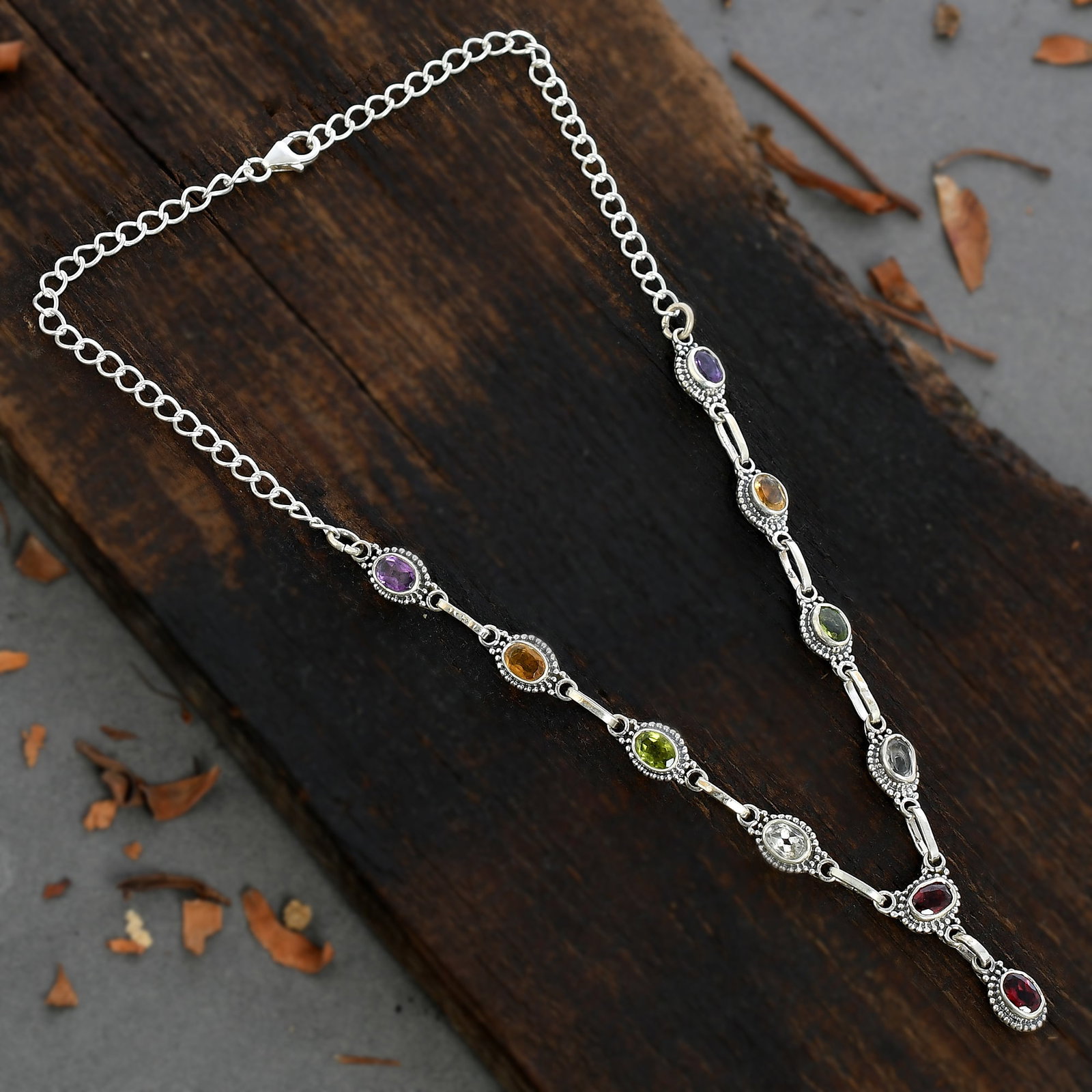 SEMI PRECIOUS MULTI GEMSTONE 92.5 STERLING SILVER NECKLACE: SEMI PRECIOUS MULTI GEMSTONE 92.5 STERLING SILVER NECKLACE Product Type : NECKLACE Main Stone : AMETHYST/CITRINE/PERIDOT/GARNET/TOPAZ Main Stone Shape : OVAL Main Stone Size : 7X5 MM Main Stone Color 