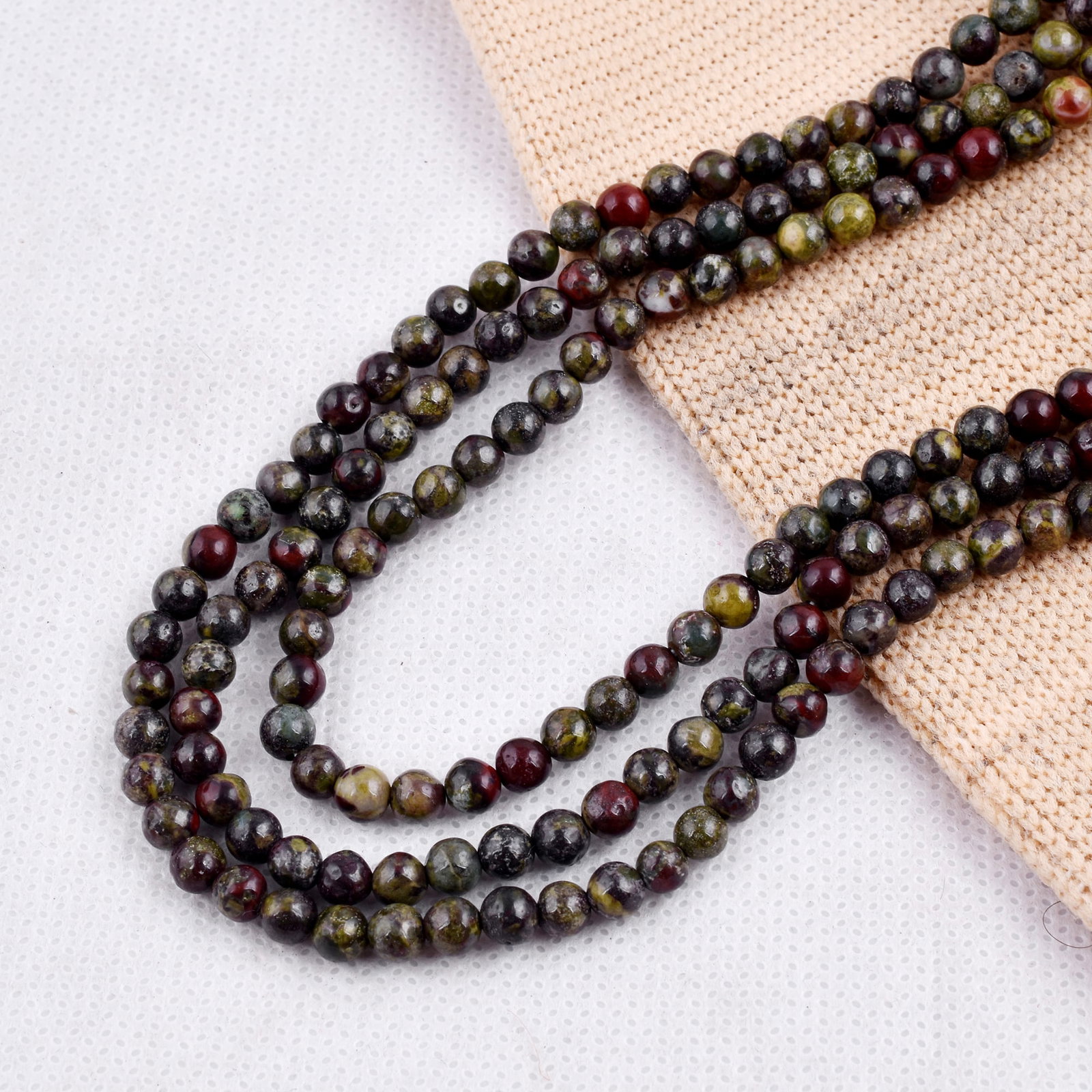 Natural Dragon Blood Stone Necklace 4 MM Round Smooth 3 String Beads Gemstone: Natural Dragon Blood Stone Gemstone 4 MM Round 3 Strings Smooth Beads Adjustable Necklace Product Type : Necklace Main Stone : Dragon Blood Stone Main Stone Shape : Round Main Stone Size : 4 MM Beads