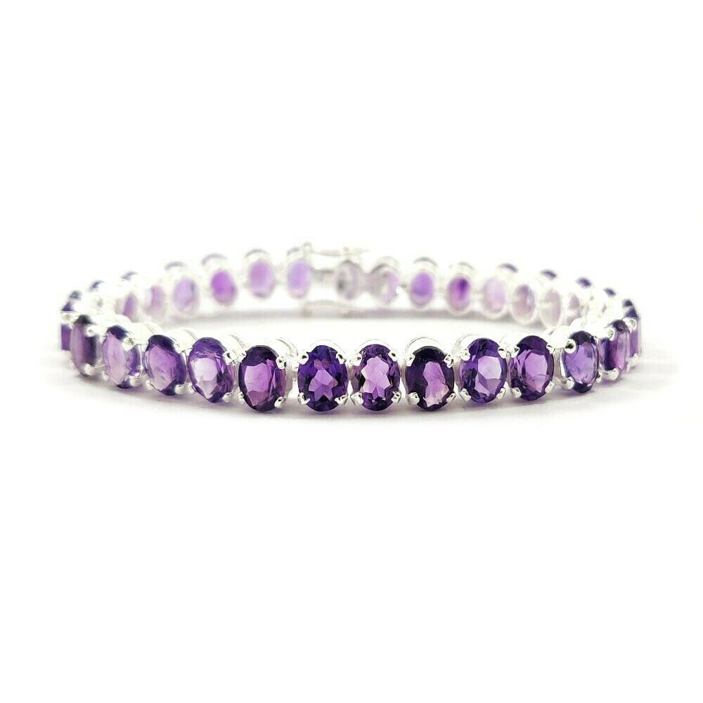 AMETHYST 92.5 STERLING SILVER TENNIS BRACELET: ITEM : BRACELET BRACELET TYPE : TENNIS MAIN STONE : AMETHYST MAIN STONE SHAPE : OVAL MAIN STONE SIZE : 7X5 MM MAIN STONE COLOR : PURPLE METAL : STERLING SILVER METAL PURITY : 925 BRACELET SIZE : 6" GE