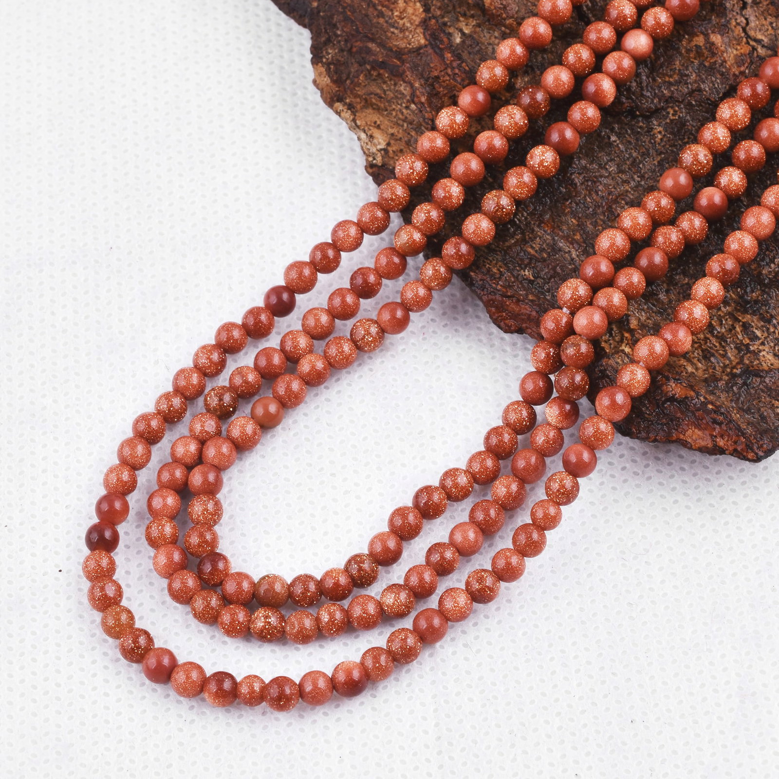 Natural Golden Sandstone Necklace 4 MM Round Smooth 3 String Beads Gemstone: Natural Golden Sandstone Gemstone 4 MM Round 3 Strings Smooth Beads Adjustable Necklace Product Type : Necklace Main Stone : Golden Sandstone Main Stone Shape : Round Main Stone Size : 4 MM Beads Type