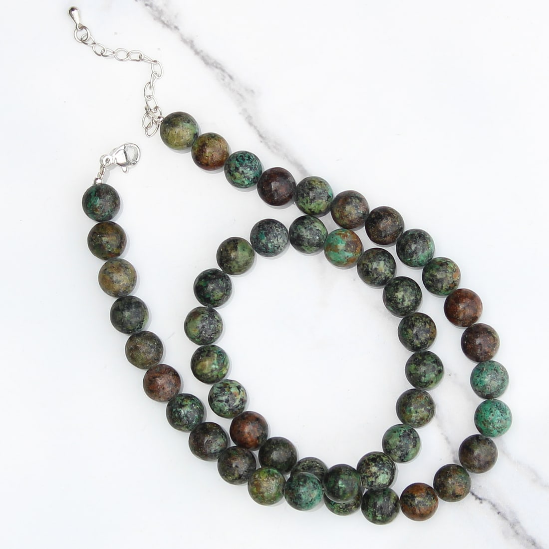 Natural African Turquoise 8 MM Round Smooth Beads Necklace: Natural African Turquoise 8 MM Round Smooth Beads Necklace Gemstone : African Turquoise Shape : Round Beads Beads Size : 8 MM Beads Type : Smooth Necklace Length : 17.5 Inches + 2.5 Inches Adjustab