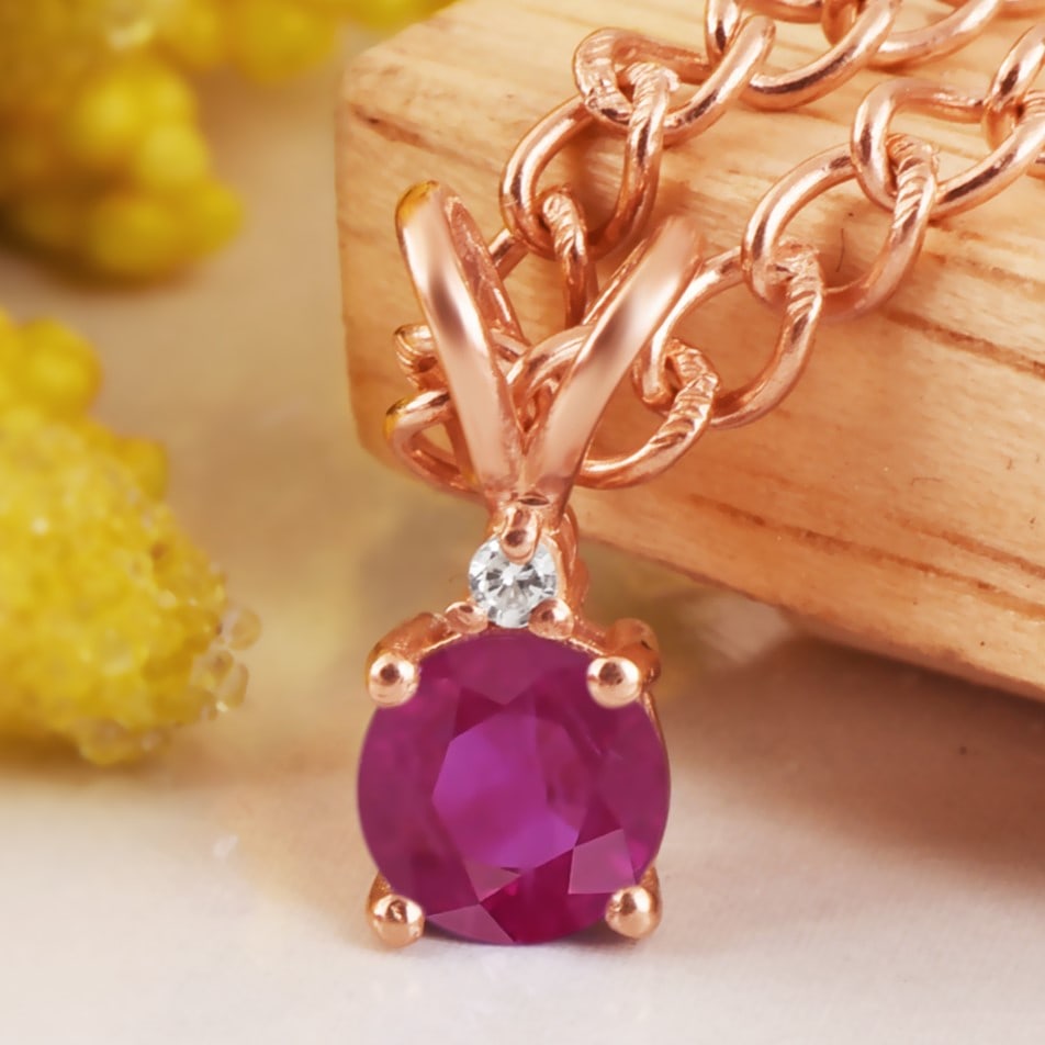 Natural Ruby & Diamond 14 KT White Gold Pendant: Natural Ruby & Diamond 14 KT White Gold Pendant Jewelry Type : Pendant Main Stone : Ruby & Diamond Main Stone Shape & Size : Round 5 MM Main Stone Color : Red Diamond Shape & Size : Round 1.50 MM</