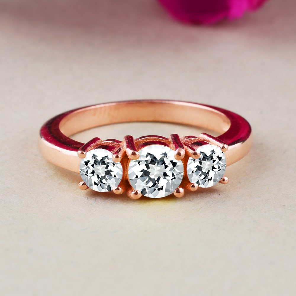 Natural White Topaz 14 KT Rose Gold Ring: Natural White Topaz 14 KT Rose Gold Ring Jewelry Type : Ring Main Stone : White Topaz Main Stone Shape & Size : Round 5 MM & 4 MM Main Stone Color : White