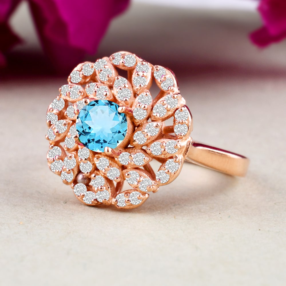 Natural Blue Topaz & Diamond 14 KT Rose Gold Ring: NATURAL BLUE TOPAZ GEMSTONE & DIAMOND 14 KT ROSE GOLD RING JEWELRY TYPE : RING MAIN STONE : BLUE TOPAZ MAIN STONE SHAPE & SIZE : ROUND 5 MM DIAMOND SHAPE & SIZE: ROUND 1.25 MM MAIN STONE COLOR : BL