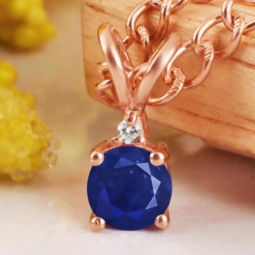Natural Blue Sapphire & Diamond 14 KT White Gold Pendant: Natural Blue Sapphire & Diamond 14 KT White Gold Pendant Jewelry Type : Pendant Main Stone : Blue Sapphire & Diamond Main Stone Shape & Size : Round 5 MM Main Stone Color : Blue Diamond Shape & Size :