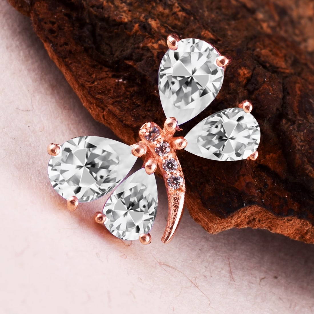 Natural White Topaz & Diamond 14 KT Rose Gold Butterfly Pendant: Natural White Topaz & Diamond 14 KT Rose Gold Butterfly Pendant Jewelry Type : Pendant Main Stone : White Topaz & Diamond Main Stone Shape & Size : Pear 7x5 & 6x4 MM Main Stone Color : White Diamond S