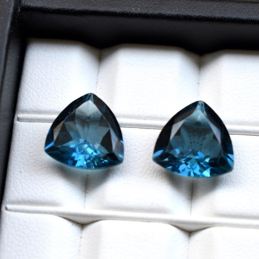 Natural London Blue Topaz 10 MM Trillion Cut Gemstone Pair: Natural London Blue Topaz 10 MM Trillion Cut Gemstone Pair Gemstone : London Blue Topaz Stone Shape : Trillion Stone Cutting Type : Faceted Cut Stone Weight : 9.05 Carats Stone Measurement : <