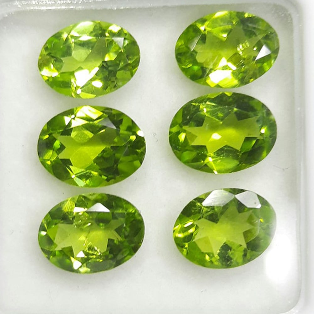 Peridot 11x9 MM Oval Faceted Cut 5 Pieces: Natural Peridot 11x9 MM Oval Faceted Cut 5 Pieces Gemstone : Peridot Shape : Oval Size : 11x9 MM Color : Green Type : Faceted Cut Quantity : 5 Pieces Weight : 18.35 Car